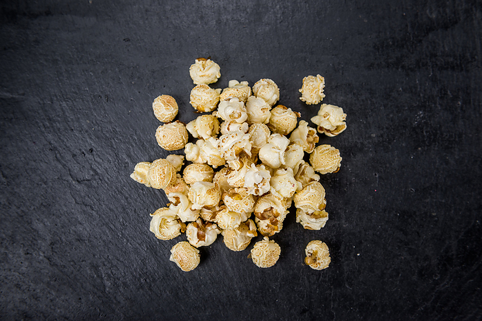 Portion of Popcorn on a slate slab Portion of Popcorn on a slate slab, by Zoonar Christoph Sch