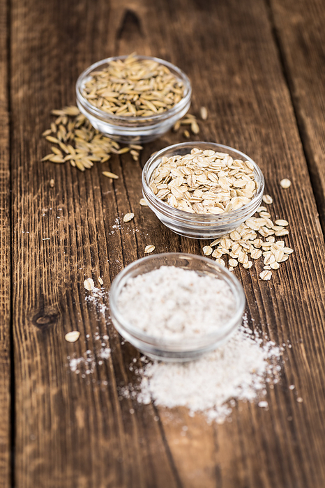 Some fresh Oat Flour on wooden background  selective focus  close up shot  Some fresh Oat Flour on wooden background  selective focus  close up shot , by Zoonar Christoph Sch