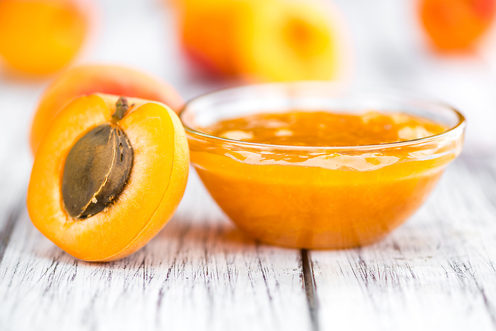 Portion of Apricot Jam on wooden background  selective focus  Portion of Apricot Jam on wooden background  selective focus , by Zoonar Christoph Sch