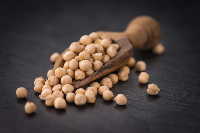 Rustic slate slab with dried Chickpeas, selective focus Rustic slate slab with dried Chickpeas, selective focus, by Zoonar Christoph Sch
