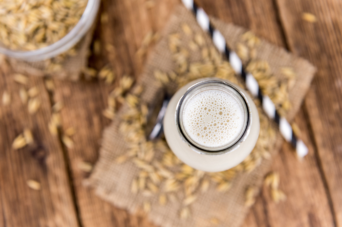 Portion of fresh Oat Milk  selective focus  close up shot  Portion of fresh Oat Milk  selective focus  close up shot , by Zoonar Christoph Sch