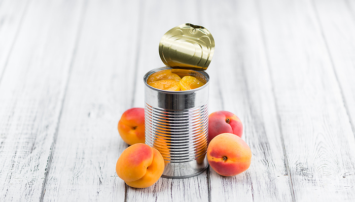 Preserved Apricots on wooden background  selective focus  Preserved Apricots on wooden background  selective focus , by Zoonar Christoph Sch