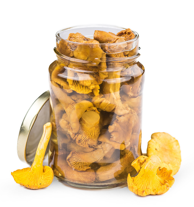 Canned chanterelles isolated on white Canned chanterelles isolated on white, by Zoonar Christoph Sch