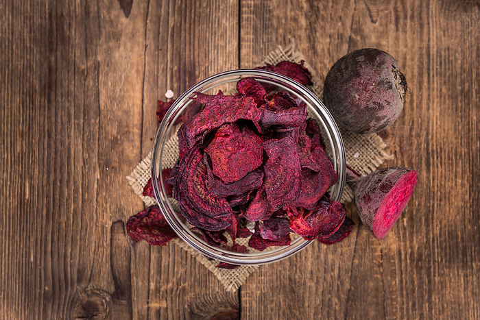 Beetroot Chips on an old wooden table  selective focus  Beetroot Chips on an old wooden table  selective focus , by Zoonar Christoph Sch