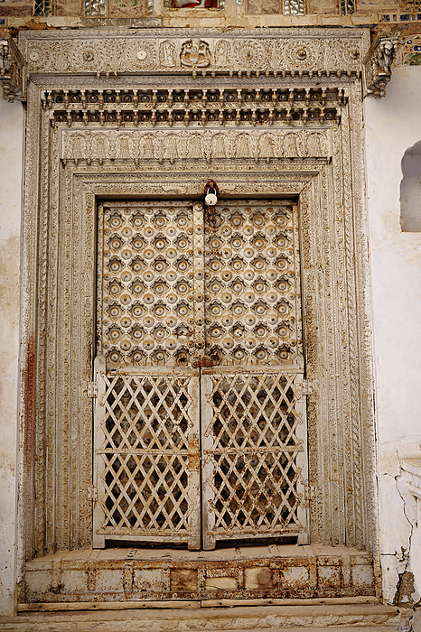 Old wooden door of 1100 Khidkiyon Ki Haveli, owned by Babulal Surana, located in Churu, Shekhawati, Rajasthan, India Old wooden door of 1100 Khidkiyon Ki Haveli, owned by Babulal Surana, located in Churu, Shekhawati, Rajasthan, India, by Zoonar RealityImages
