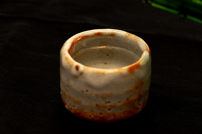 Sake poured into a ceramic sake cup