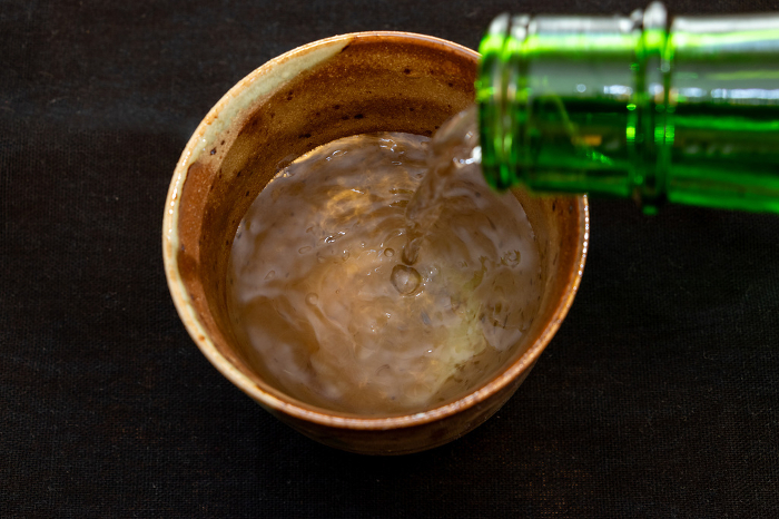 Sake poured into ceramic cups