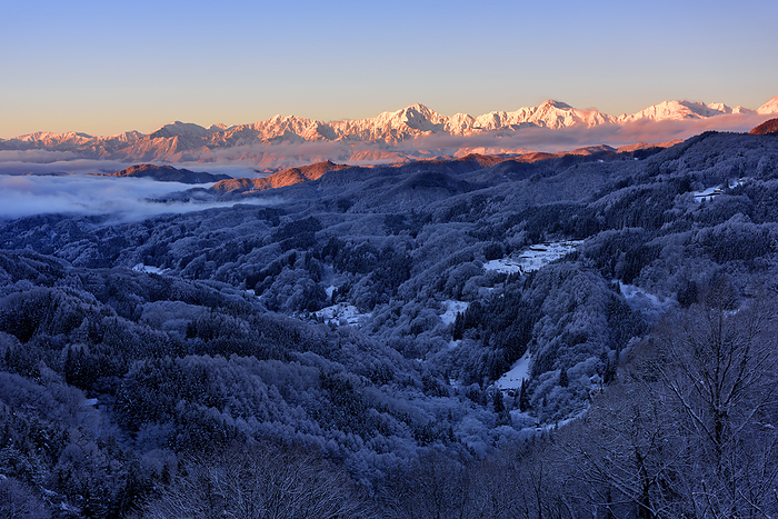 Morning view of the Northern Alps and sea of clouds in severe winter from Omotoge Pass, Nagano Prefecture