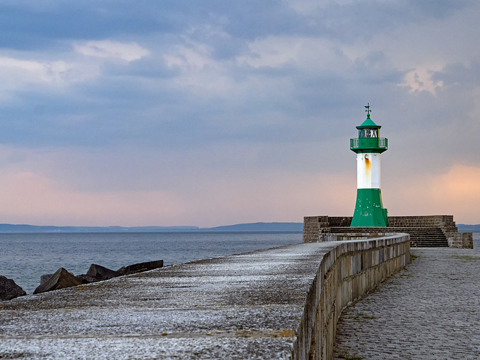 The pier in the town harbor of Sassnitz on the island of R gen with the beacon, Germany The pier in the town harbor of Sassnitz on the island of R gen with the beacon, Germany, by Zoonar Katrin May