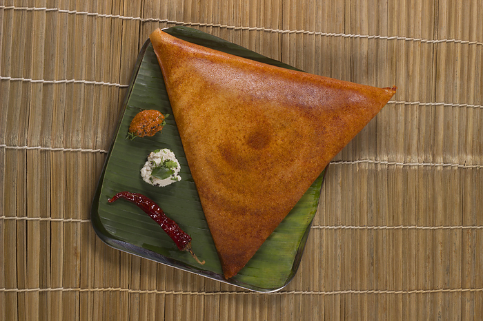 Paper Dosa with sambar and coconut chutney. South Indian Vegetarian Snack Paper Dosa with sambar and coconut chutney. South Indian Vegetarian Snack, by Zoonar RealityImages