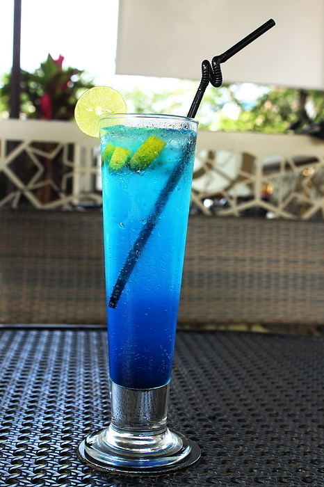 Blue ice land mocktail in tall glass with straw Blue ice land mocktail in tall glass with straw, by Zoonar RealityImages