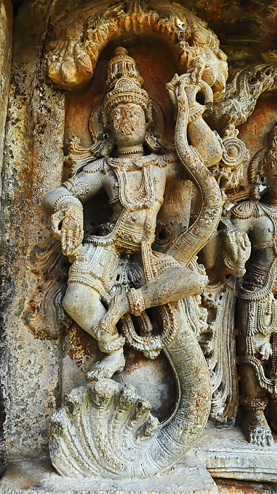 Sculpture of Lord Krishna dancing on Kaliya Snake, Mallikarjuna Temple, Basaralu, Mandya, Karnataka, India. Sculpture of Lord Krishna dancing on Kaliya Snake, Mallikarjuna Temple, Basaralu, Mandya, Karnataka, India., by Zoonar RealityImages