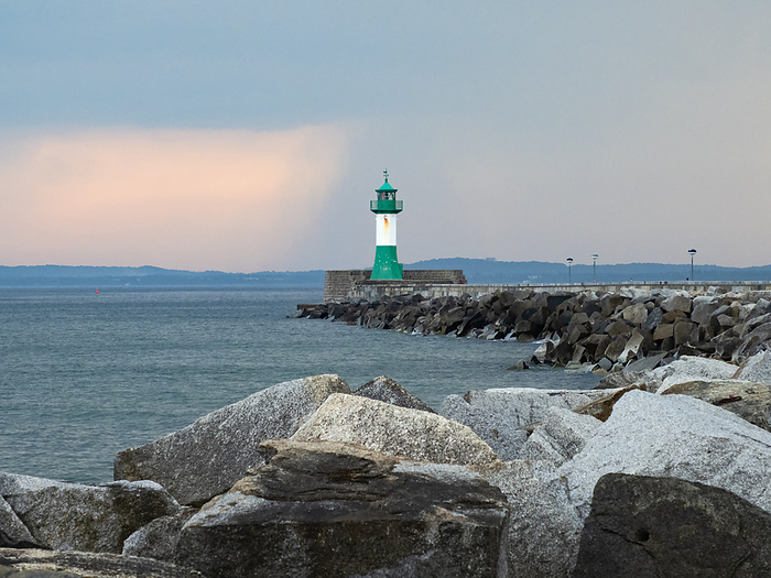 The pier in the town harbor of Sassnitz on the island of R gen with a lighthouse, Germany The pier in the town harbor of Sassnitz on the island of R gen with a lighthouse, Germany, by Zoonar Katrin May