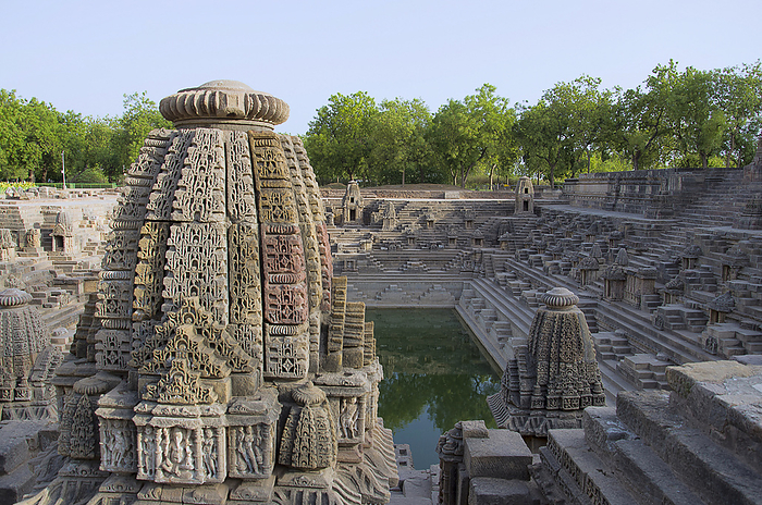 Small shrines and steps to reach the bottom of the reservoir, of the Sun Temple. Modhera village of Mehsana district, Gujarat, India Small shrines and steps to reach the bottom of the reservoir, of the Sun Temple. Modhera village of Mehsana district, Gujarat, India, by Zoonar RealityImages