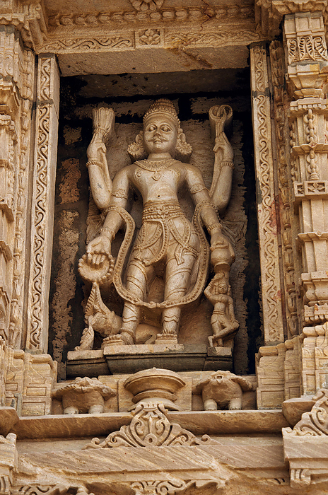 Carved idol on the outer wall, Hatkeshwar Mahadev, 17th century temple, the family deity of Nagar Brahmins. Vadnagar, Gujarat, India Carved idol on the outer wall, Hatkeshwar Mahadev, 17th century temple, the family deity of Nagar Brahmins. Vadnagar, Gujarat, India, by Zoonar RealityImages