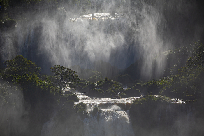 Mystical view to waterfall cascades with a wall of spray and sunlight, Iguazu Falls, Misiones, Argen Mystical view to waterfall cascades with a wall of spray and sunlight, Iguazu Falls, Misiones, Argen, by Zoonar Uwe Bergwitz