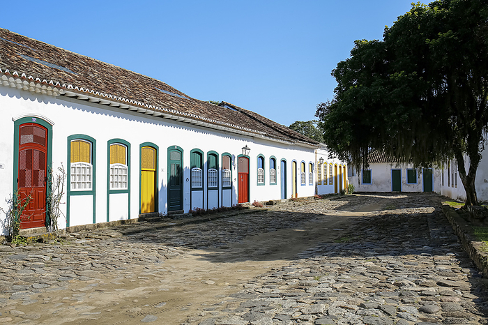 Typical house facades with colorful doors and windows on sunny day in historic town Paraty, Brazil, Unesco World Heritage Typical house facades with colorful doors and windows on sunny day in historic town Paraty, Brazil, Unesco World Heritage, by Zoonar Uwe Bergwitz