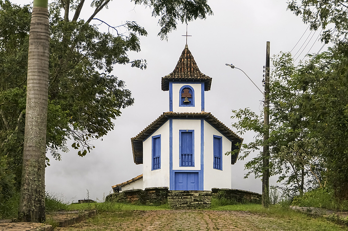Colonial chapel framed by trees and foggy background, Catas Altas, Minas Gerais, Brazil Colonial chapel framed by trees and foggy background, Catas Altas, Minas Gerais, Brazil, by Zoonar Uwe Bergwitz