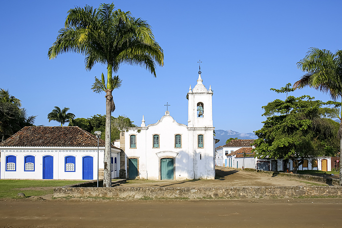 Church Nossa Senhora das Dores  Our Lady of Sorrows  with two palm trees on a sunny day, historic to Church Nossa Senhora das Dores  Our Lady of Sorrows  with two palm trees on a sunny day, historic to, by Zoonar Uwe Bergwitz