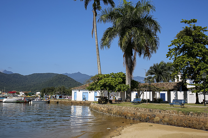 View to waterfront in historic town Paraty with colonial buildings, trees, sea and Atlantic forest m View to waterfront in historic town Paraty with colonial buildings, trees, sea and Atlantic forest m, by Zoonar Uwe Bergwitz
