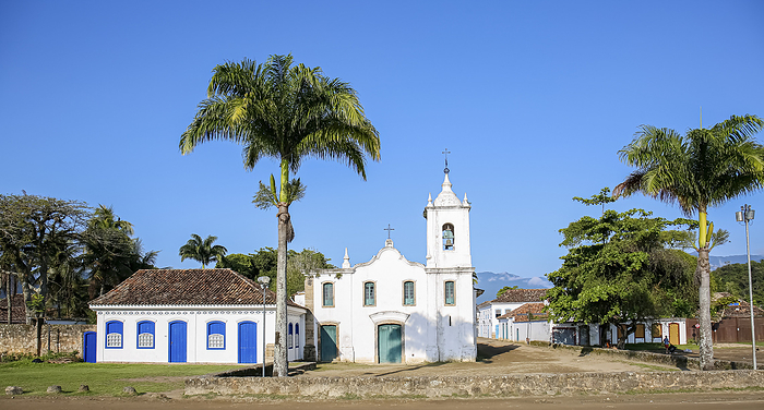 Arial view panorama of church Nossa Senhora das Dores  Our Lady of Sorrows  with palm trees on a sun Arial view panorama of church Nossa Senhora das Dores  Our Lady of Sorrows  with palm trees on a sun, by Zoonar Uwe Bergwitz