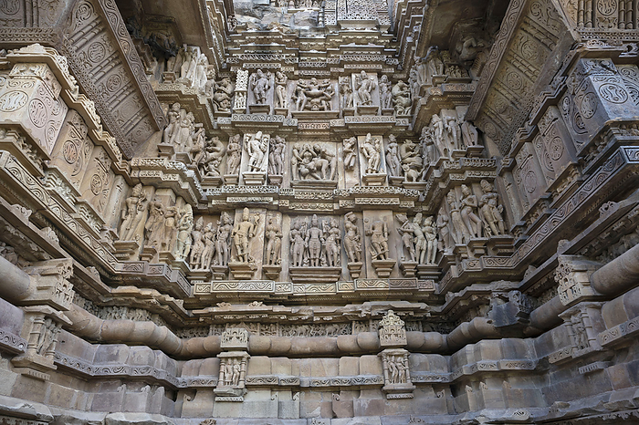 VISHWANATH TEMPLE: North wall . Top and middle panel Mithuna couple erotic panel and bottom deity panel.