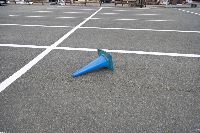 Blue color cones lying in the parking lot.