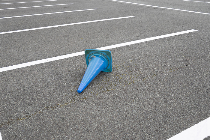 Blue color cones lying in the parking lot.