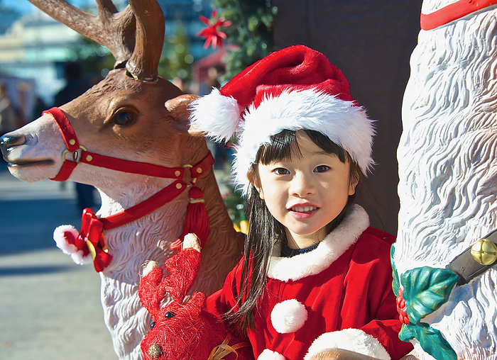 Girl dressed as Santa Claus