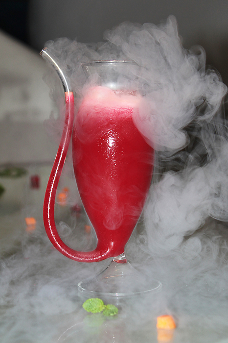 Smoke from drink. Beetroot and carrot drink mocktail or cocktail Smoke from drink. Beetroot and carrot drink mocktail or cocktail, by Zoonar RealityImages
