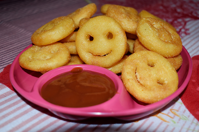 Homemade fried  Potato Smiley Emoji Fries, Pune Maharashtra. Homemade fried  Potato Smiley Emoji Fries, Pune Maharashtra., by Zoonar RealityImages