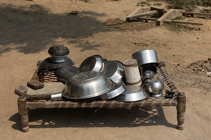 Tribal utensils druing on a bed outside. Tribal utensils druing on a bed outside., by Zoonar RealityImages