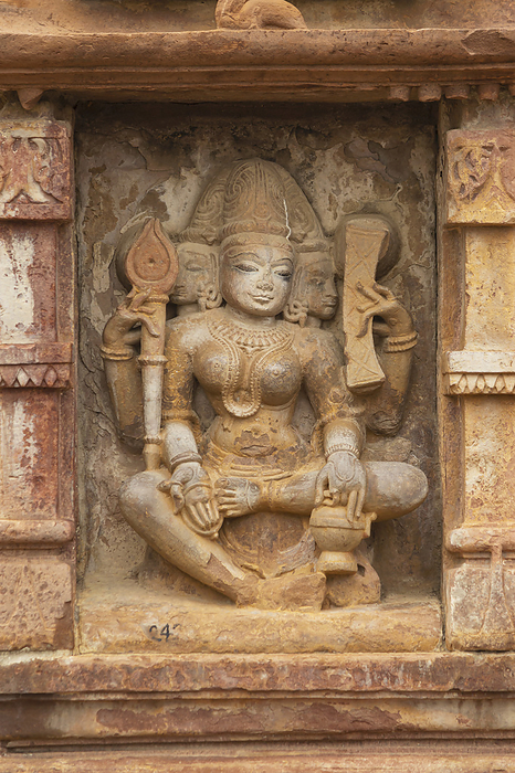 Sculpture of Hindu Goddess with three Faces on the Shiv Temple of Menal, Build by King Someshwar Chamhana in 11th Century, Begun, Chittorgarh, Rajasthan, India. Sculpture of Hindu Goddess with three Faces on the Shiv Temple of Menal, Build by King Someshwar Chamhana in 11th Century, Begun, Chittorgarh, Rajasthan, India., by Zoonar RealityImages