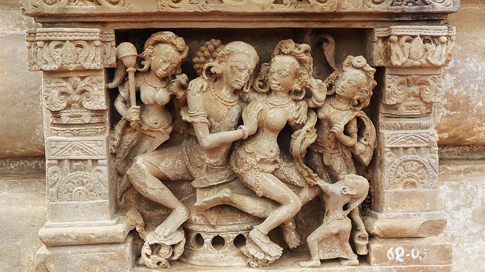 Sculpture of man and several women. Amorous activities.  Harshad Mata Temple, Abhaneri, Dausa, Rajsathan, India. Sculpture of man and several women. Amorous activities.  Harshad Mata Temple, Abhaneri, Dausa, Rajsathan, India., by Zoonar RealityImages