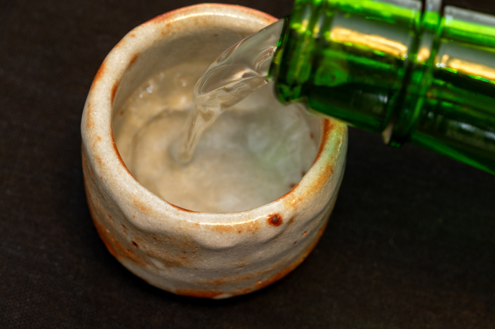 Sake poured into a boar cup
