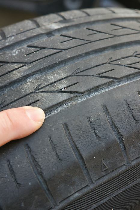 Point and check the triangular mark on the tire slip sign.