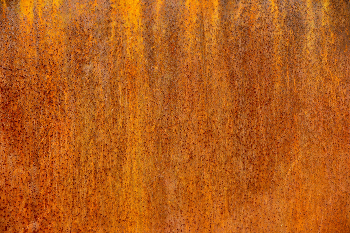 Rusty iron plate exposed to wind and rain