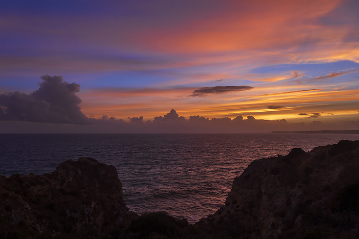 Portugal Portugal, Algarve, Lagos, Shore of Atlantic Ocean at dusk