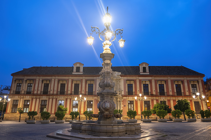 Seville, Spain Spain, Andalusia, Seville, Archbishops Palace and Fuente Farola street light at dusk