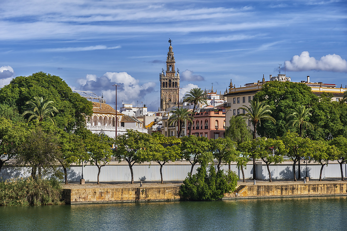 Seville, Spain Spain, Andalusia, Seville, Riverside promenade with Giralda bell tower in background