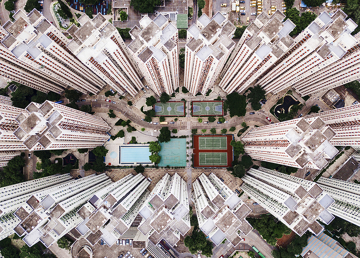 Aerial view Buildings with swimming pool and sports court in city