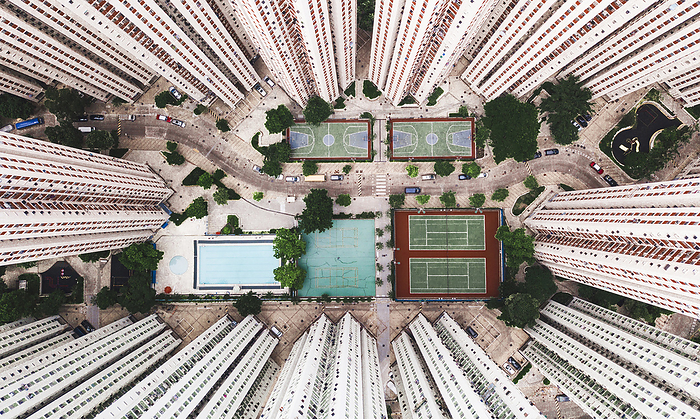 Aerial view of Hong Kong Sports courts with swimming pool near tall buildings in Hong Kong city