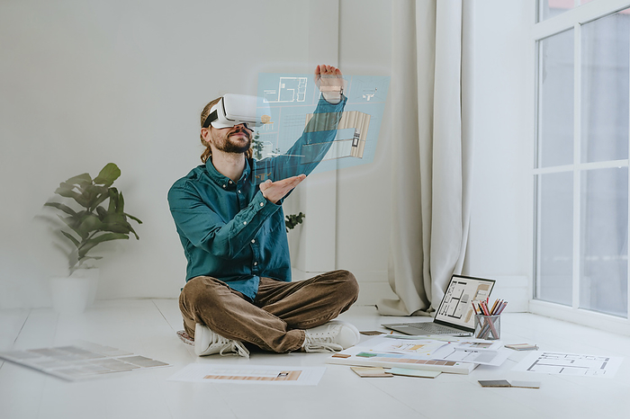 Interior designer designing project using VR glasses at office