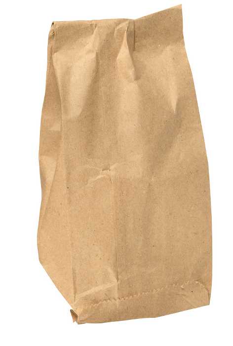 Brown kraft paper bag for packaging products in stores on an isolated background Brown kraft paper bag for packaging products in stores on an isolated background