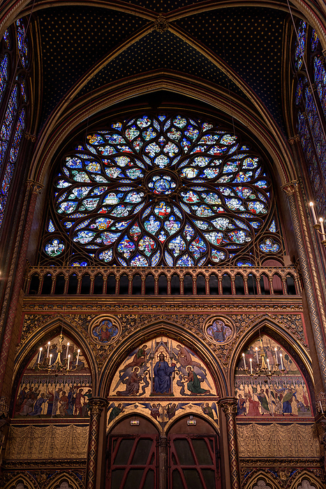 Sainte Chapelle, Paris, upper floor rose window Sainte chapelle  Sainte chapelle  English name: Sainte Chapelle  Address. Sainte Chapelle, meaning  holy chapel,  is a Gothic church on the Isle de la Cit  in central Paris, France, and is said to have the oldest stained glass windows in Paris. It is said to be the pinnacle of the most brilliant period of Gothic architecture. The date of construction is unknown, but it was dedicated on April 26, 1248, and the construction period is thought to have lasted from four to six years. The stained glass windows of Sainte Chapelle are said to be the most visually beautiful of all church buildings and one of the finest in the world. The rose window was added to the upper chapel in the 15th century, and the 15 meter high stained glass windows, 15 of which are from the Bible, cover a total area of 640 m2 and are composed of 1,134 scenes from Genesis to the Resurrection of Christ. The walls flanked by the stained glass windows are lined with statues of the 12 apostles. The Sainte Chapelle, known as the  Sacred Jewel Box,  was declared a historic monument in 1862, and in 1991, it was registered as a World Heritage Site  cultural heritage , along with Notre Dame Cathedral, under the name of  The Seine in Paris. It is currently under the management of the French National Monuments Center. The upper chapel in the photo is the exclusive chapel of the royal family and was once connected to the king s apartment. This west rose window represents John s prophetic book, the Book of Revelation. 