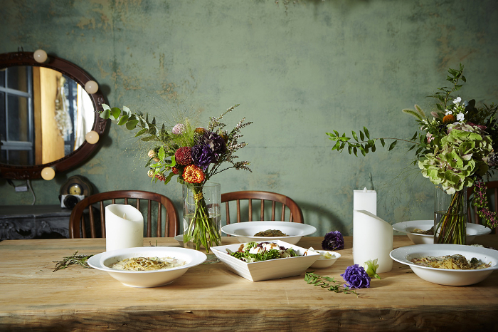 Arranged flowers with wildflowers Table arrangement image
