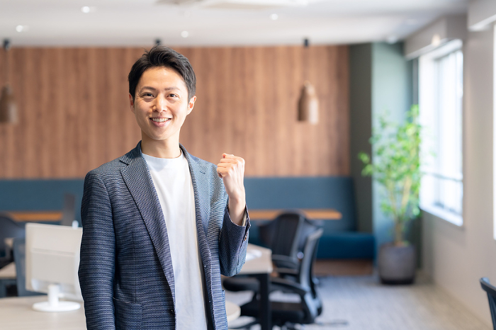 Middle Japanese man working in office (People)