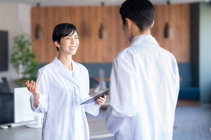 Young Japanese female doctor in a meeting (People)