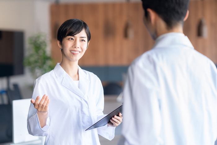 Young Japanese female doctor in a meeting (People)
