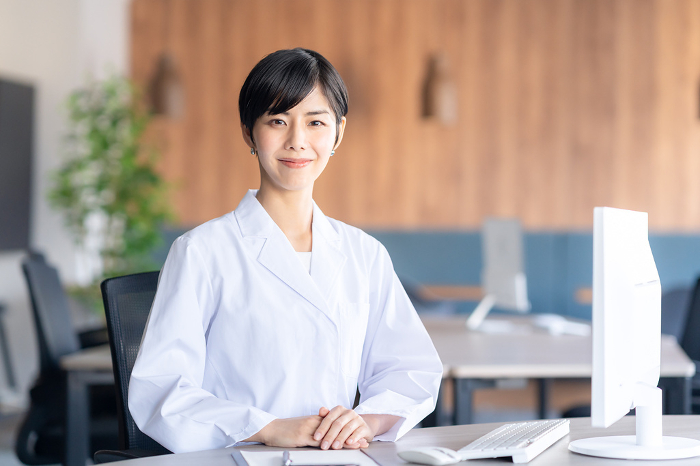 Young Japanese female scientist working in a lab (People)